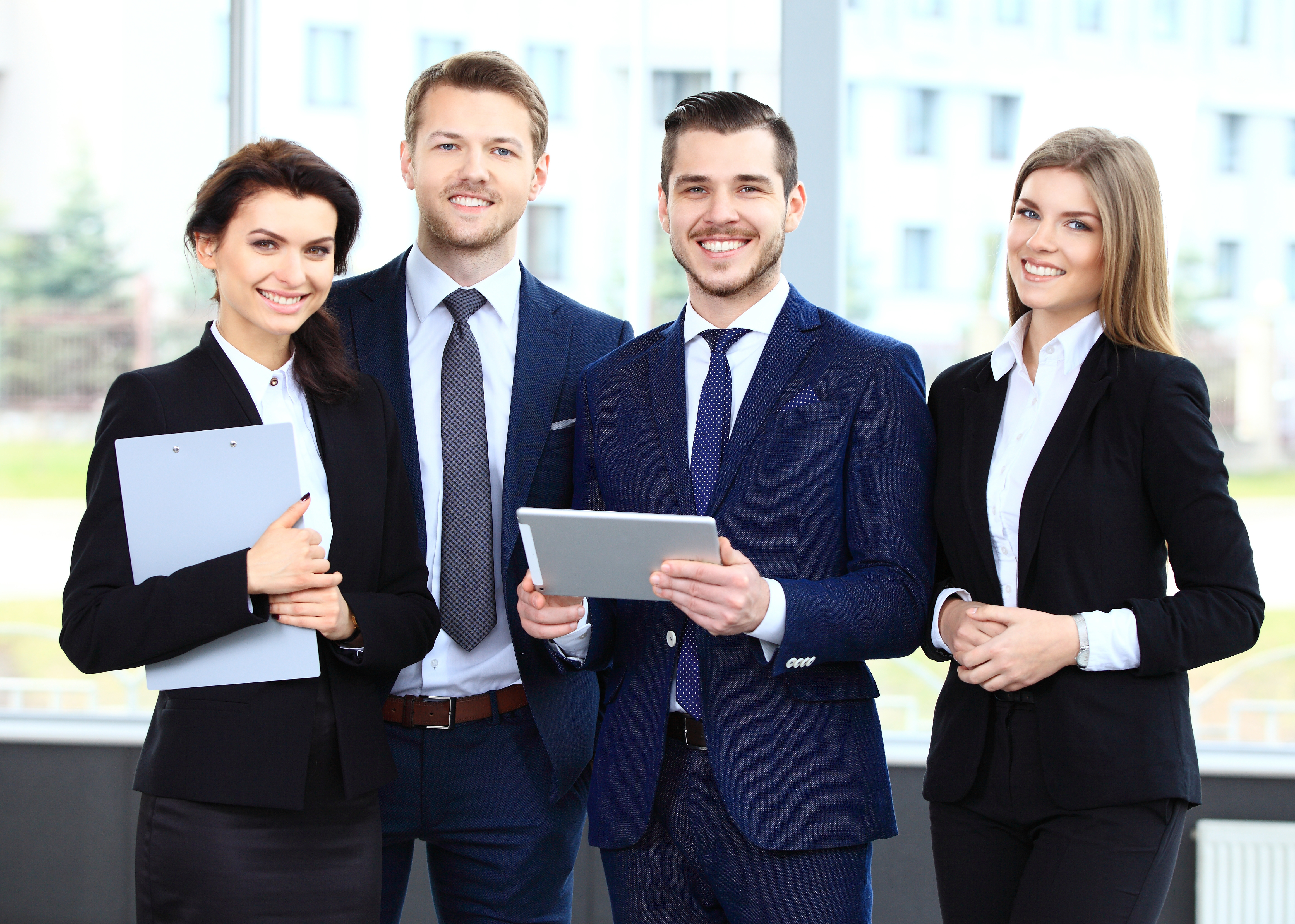 Happy smiling business team in office Happy smiling business team in office